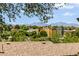 Picturesque neighborhood view with colorful buildings and mountain backdrop, framed by trees at 4647 W Dakota Ave, Denver, CO 80219