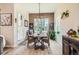 Charming dining room filled with light, a rustic wood table, and stylish décor to complete your dining experience at 21985 E Bailey Pl, Aurora, CO 80016