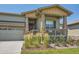 Charming home exterior with stone accents, a welcoming porch, and a convenient attached garage at 21985 E Bailey Pl, Aurora, CO 80016