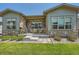 Charming front porch with stone accents, providing a cozy outdoor seating area and enhancing curb appeal at 21985 E Bailey Pl, Aurora, CO 80016