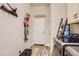 Functional laundry room featuring modern appliances, shelving and convenient storage at 21985 E Bailey Pl, Aurora, CO 80016