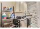 Laundry room boasts white cabinets and a full sized washer and dryer set at 21985 E Bailey Pl, Aurora, CO 80016