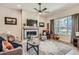 Inviting living room features a fireplace, natural light, and comfortable seating for a cozy atmosphere at 21985 E Bailey Pl, Aurora, CO 80016