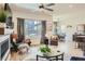 Bright living area with large window, fireplace, and open layout offers a comfortable and inviting space at 21985 E Bailey Pl, Aurora, CO 80016
