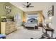 Spacious main bedroom featuring a ceiling fan, large bed, carpet and decorative accents at 21985 E Bailey Pl, Aurora, CO 80016