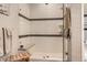 Modern shower with a glass door, tiled walls, built-in niche, and seating at 21985 E Bailey Pl, Aurora, CO 80016