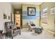 Inviting sitting room with comfortable seating, soft lighting, and neutral color scheme at 21985 E Bailey Pl, Aurora, CO 80016