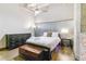 Bedroom with hardwood floors, dresser, chest and cool modern lamps at 2000 Arapahoe St # 305, Denver, CO 80205