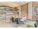 Beautiful dining room with wood accents, brick walls, and a modern table set for an inviting dining experience at 2000 Arapahoe St # 305, Denver, CO 80205