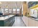 Well-designed kitchen with island, modern appliances, and stylish backsplash combining functionality and aesthetic appeal at 2000 Arapahoe St # 305, Denver, CO 80205