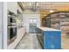 Elegant kitchen boasts modern appliances, sleek cabinetry, and spacious island, ideal for culinary creativity and entertaining at 2000 Arapahoe St # 305, Denver, CO 80205