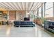 Spacious living room with exposed brick, open layout, and modern decor at 2000 Arapahoe St # 305, Denver, CO 80205