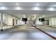 Spacious basement area with mirrored walls and glass door entrances perfect for a dance or yoga studio at 1030 S Adams St, Denver, CO 80209