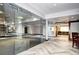 Finished basement with herringbone floor and a glass-walled gym at 1030 S Adams St, Denver, CO 80209