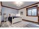Stylish bedroom featuring wood trim, wood-style floors, a cozy bed, and modern decor for a comfortable retreat at 1030 S Adams St, Denver, CO 80209