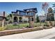 Beautiful home with stone accents, arched entryways, and a well-maintained front yard at 1030 S Adams St, Denver, CO 80209