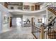 Bright foyer with wrought iron railings, soaring ceilings, travertine floors and open floor plan at 1030 S Adams St, Denver, CO 80209