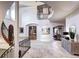 Grand foyer showcasing a spiral staircase, travertine flooring, and open design with an abundance of natural light at 1030 S Adams St, Denver, CO 80209