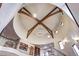 Dramatic foyer featuring a vaulted ceiling with wood beams, a chandelier, and wrought iron railings at 1030 S Adams St, Denver, CO 80209