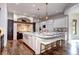 Bright kitchen with a marble island, stainless steel appliances, and stylish barstool seating at 1030 S Adams St, Denver, CO 80209