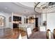 Bright, open kitchen featuring a large island, stainless steel appliances, and dark wood cabinetry at 1030 S Adams St, Denver, CO 80209