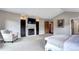 Cozy main bedroom view featuring a fireplace, TV, and comfortable seating at 1030 S Adams St, Denver, CO 80209