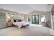Spacious main bedroom featuring vaulted ceilings and double doors to the outdoors at 1030 S Adams St, Denver, CO 80209