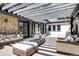 Spacious patio area with a pergola, comfortable seating, and an outdoor kitchen in the background at 1030 S Adams St, Denver, CO 80209