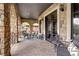 Charming stone patio featuring comfortable seating, stylish decor, and arched openings, perfect for outdoor entertaining at 1030 S Adams St, Denver, CO 80209