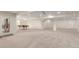 Expansive finished basement with recessed lighting, offering a billiard table and convenient access to the backyard at 6391 S Malaya St, Centennial, CO 80016