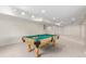 Finished basement area featuring a pool table and lighting, great for entertaining at 6391 S Malaya St, Centennial, CO 80016