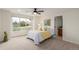 Cozy bedroom with large windows overlooking a serene outdoor landscape, providing a peaceful retreat for rest and relaxation at 6391 S Malaya St, Centennial, CO 80016