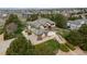 Expansive exterior elevation of home featuring a three car garage, pristine lawn, and mature trees at 6391 S Malaya St, Centennial, CO 80016
