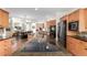 Gourmet kitchen featuring granite countertops, stainless steel appliances, and an open floor plan at 6391 S Malaya St, Centennial, CO 80016