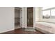 Bathroom featuring a walk-in shower, soaking tub, and walk-in closet at 6391 S Malaya St, Centennial, CO 80016