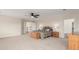 Large main bedroom with ceiling fan, carpet floors, and view into the hallway at 6391 S Malaya St, Centennial, CO 80016