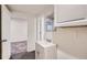 This well-lit bathroom features a modern vanity, a sink, and neutral-toned walls and flooring at 17936 Becket Dr, Parker, CO 80134