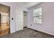 This cozy bedroom features a closet, a window, and neutral-toned walls and flooring at 17936 Becket Dr, Parker, CO 80134