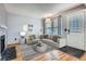 Inviting living room featuring a fireplace, hardwood floors, and lots of natural light at 17936 Becket Dr, Parker, CO 80134