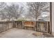Private patio area features a wooden fence and a charming wooden gate, providing an outdoor retreat at 17936 Becket Dr, Parker, CO 80134