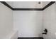 Shower featuring white marble-style tile and black accents at 17936 Becket Dr, Parker, CO 80134