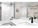 Modern bathroom with sleek fixtures, white subway tile, and a glass-enclosed shower for a spa-like experience at 2231 W 36Th Ave, Denver, CO 80211