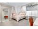 Charming bedroom featuring a four-poster bed with sheer curtains and soft, neutral tones for a cozy retreat at 2231 W 36Th Ave, Denver, CO 80211