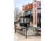 Senor Bear restaurant exterior with tables and black metal fence at 2231 W 36Th Ave, Denver, CO 80211