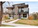 Stunning modern duplex with multiple balconies, stone accents, and well-maintained landscaping at 2231 W 36Th Ave, Denver, CO 80211
