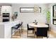 Contemporary kitchen features a breakfast bar, modern pendant lights, and stainless steel appliances at 2231 W 36Th Ave, Denver, CO 80211