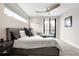 Bright and airy main bedroom with a ceiling fan, modern decor, and sliding glass doors leading to a balcony at 2231 W 36Th Ave, Denver, CO 80211