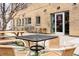 Outdoor patio seating area with tables and chairs at Fox and the Hen at 2231 W 36Th Ave, Denver, CO 80211