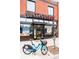 Charming restaurant exterior with large windows, brick facade, and outdoor seating area at 2231 W 36Th Ave, Denver, CO 80211