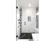 Modern walk-in shower featuring black hardware, marble tile, and mosaic accents at 2231 W 36Th Ave, Denver, CO 80211